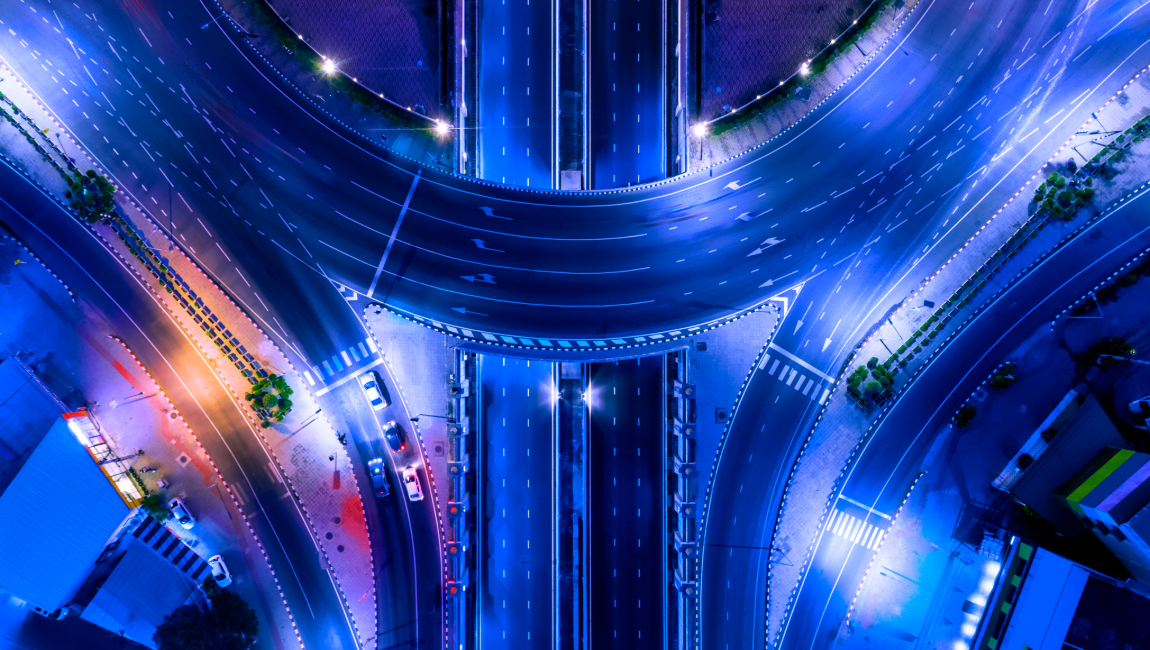 Aerial view of lit up highways at night