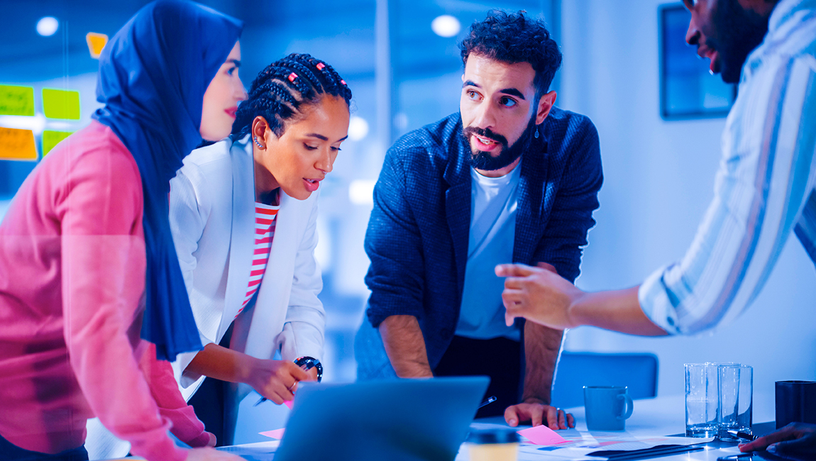 Group of diverse colleagues brainstorming in a meeting room