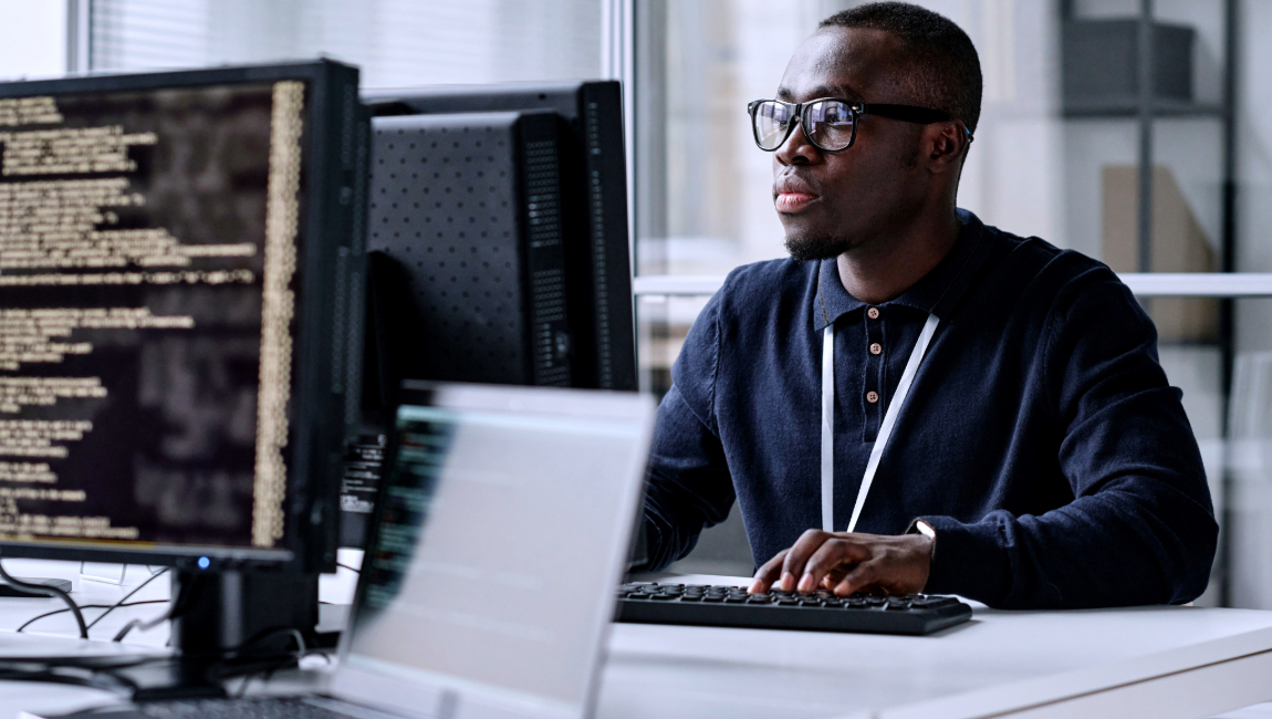 Developer looking at code on computer screen