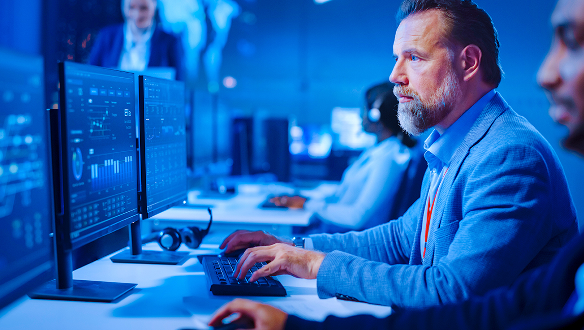 Man typing on computer