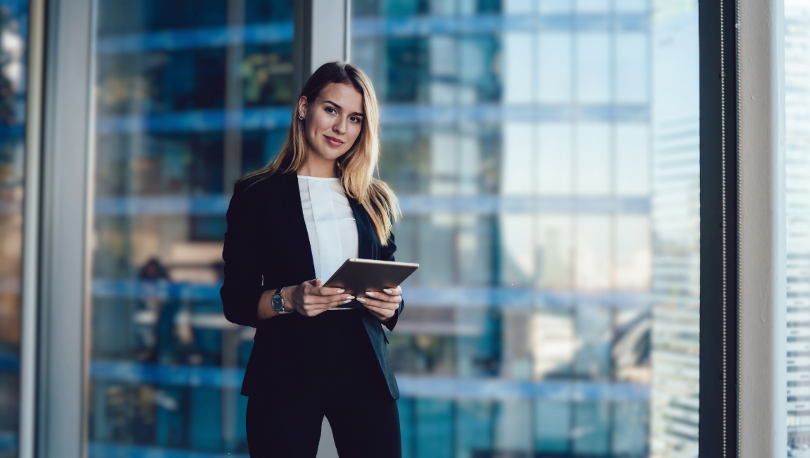 Businesswoman reading ipad cityscape