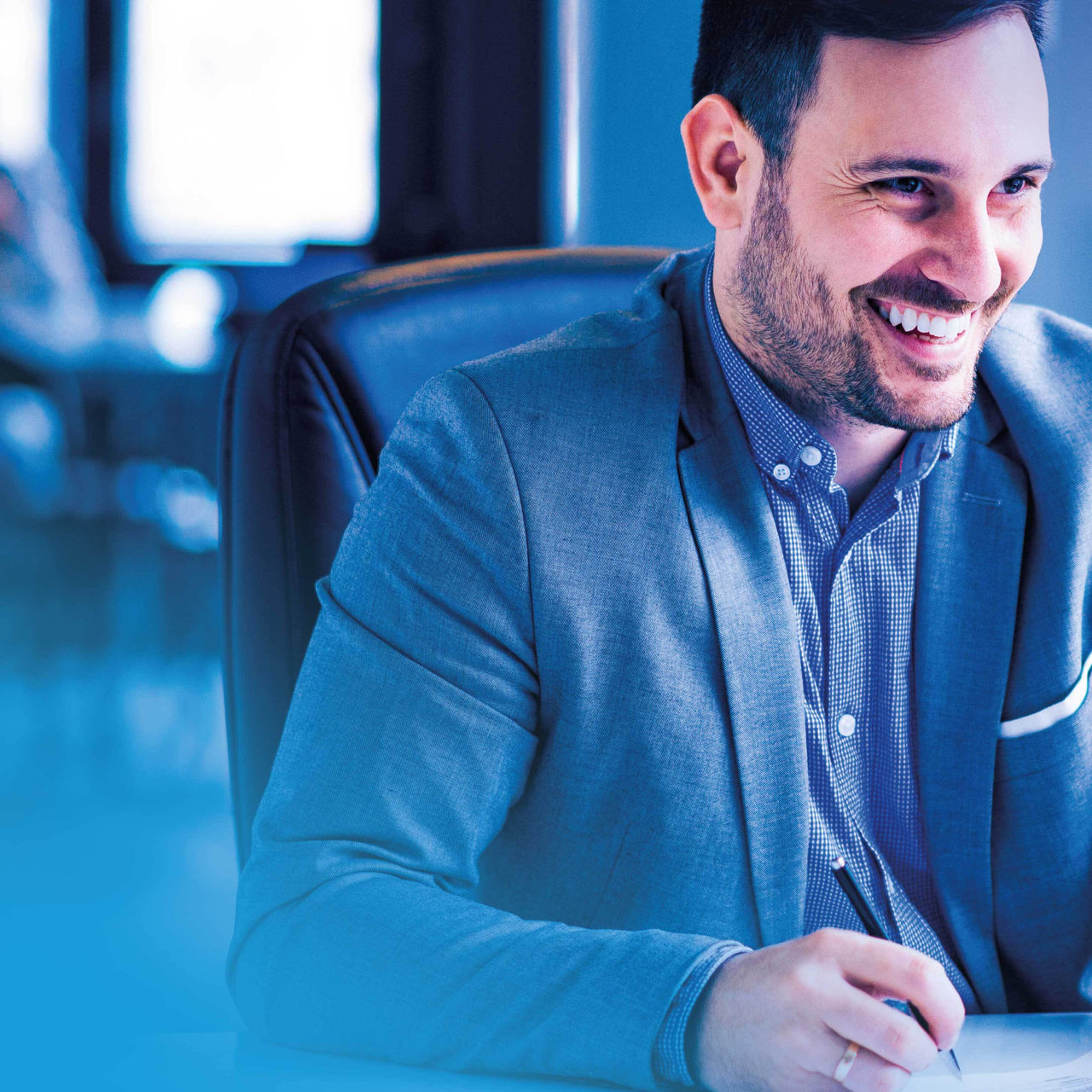 Business man smiling and writing